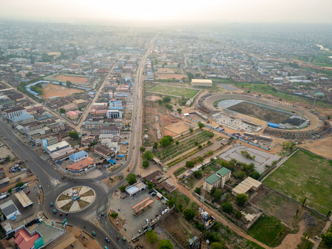 Kaduna Nigeria 13 May 2026 Aerial view of the Ahmadu Bello Stadium under renovation surrounded by urban sprawl a busy roundabout and residential buildings under a hazy sky. Kaduna Nigeria 13 May 2026 Aerial view of the Ahmadu Bello Stadium under renovation surrounded by urban sprawl a busy roundabout and residential buildings under a hazy sky.
