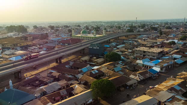 Tamale Northern Region Ghana 16 March 2023 Aerial view of Tamale Interchange with its elevated roadway winding through the urban landscape featuring a mosque with a green dome.