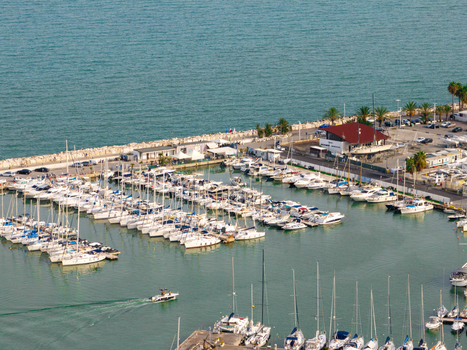 Aerial view of the marina featuring numerous sailboats and yachts docked near the port authorities building with calm sea waters. San Benedetto del Tronto Marche Italy. Aerial view of the marina featuring numerous sailboats and yachts docked near the port authorities building with calm sea waters. San Benedetto del Tronto Marche Italy.