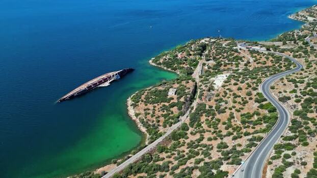 Aerial view of shipwreck in a coastal bay Greece.
