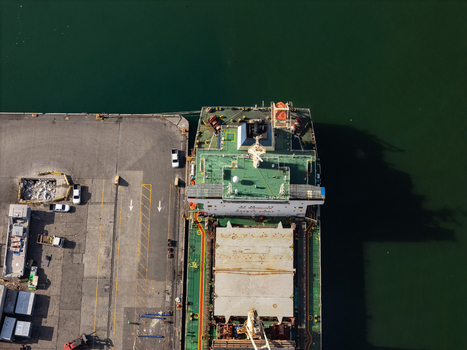 Aerial view of a cargo ship docked at the industrial port of Bajos de Haina San Cristobal Province Dominican Republic.