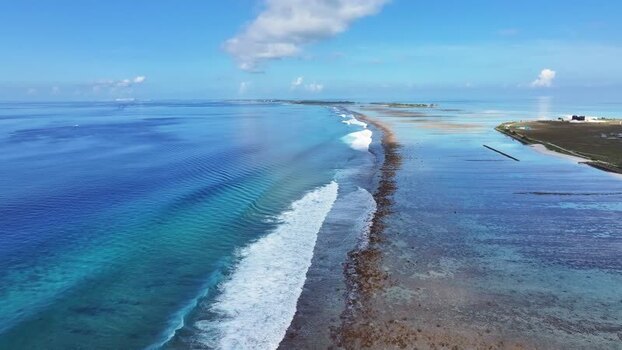Aerial view of waves breaking over a coral reef Maldives. Aerial view of waves breaking over a coral reef Maldives.