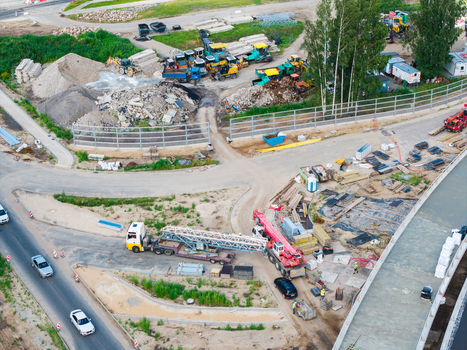 Riga Latvia 04 July 2026 Aerial view of the Janis Cakste Avenue construction project featuring heavy machinery building materials and ongoing road work near the Southern Bridge corridor. Riga Latvia 04 July 2026 Aerial view of the Janis Cakste Avenue construction project featuring heavy machinery building materials and ongoing road work near the Southern Bridge corridor.