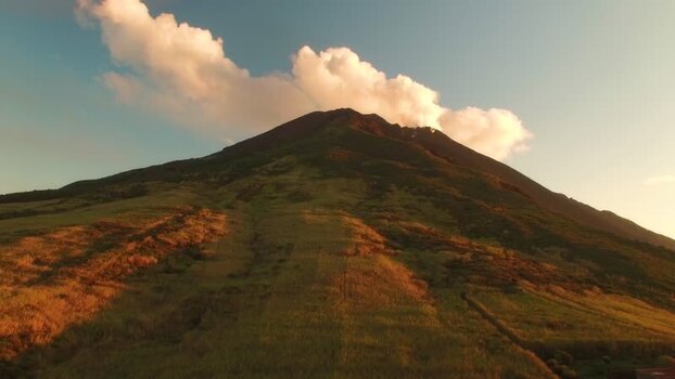 Aerial view of a volcanic peak with smoke Italy.