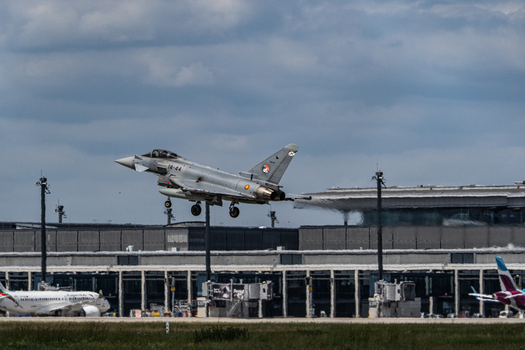 Berlin Germany 13 June 2026 View of a Eurofighter Typhoon taking off during the ILA Berlin Air Show at Berlin Airport with terminal buildings and cloudy sky. Berlin Germany 13 June 2026 View of a Eurofighter Typhoon taking off during the ILA Berlin Air Show at Berlin Airport with terminal buildings and cloudy sky.