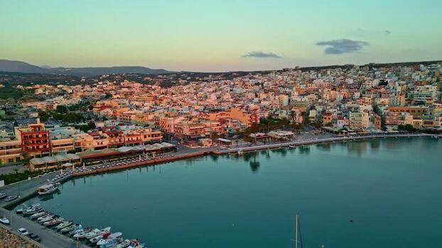 Aerial view of Crete coastal town at sunset Greece.