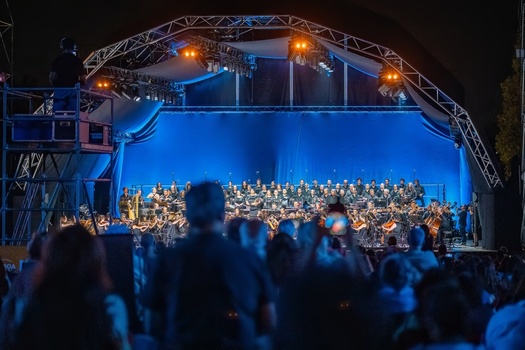 Lisboa Portugal 05 September 2026 View of an outdoor orchestra performing on a stage illuminated by blue lights at Parque do Vale do Silencio with a large audience. Lisboa Portugal 05 September 2026 View of an outdoor orchestra performing on a stage illuminated by blue lights at Parque do Vale do Silencio with a large audience.