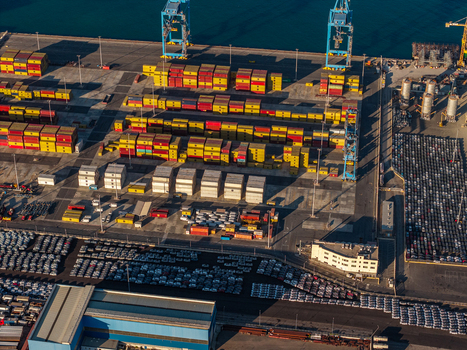Civitavecchia Lazio Italy 23 August 2026 Aerial view of Civitavecchia Port with rows of colorful shipping containers parked vehicles and industrial cranes.