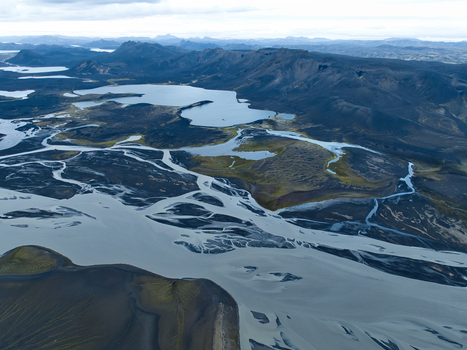 Aerial view of Skyggnisvatn lake surrounded by volcanic landscape glacial rivers and dark sand plains in the highlands Hella Rangarthing ytra Iceland. Aerial view of Skyggnisvatn lake surrounded by volcanic landscape glacial rivers and dark sand plains in the highlands Hella Rangarthing ytra Iceland.
