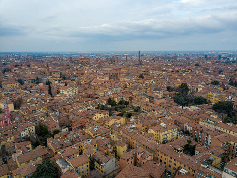 Aerial view of the historic center with terracotta rooftops and the iconic Two Towers rising above the medieval cityscape in Bologna Emilia Romagna Italy. Aerial view of the historic center with terracotta rooftops and the iconic Two Towers rising above the medieval cityscape in Bologna Emilia Romagna Italy.