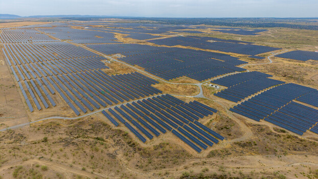 Aerial view of a large solar farm with rows of photovoltaic panels stretching across the arid landscape in Talavan Extremadura Spain. Aerial view of a large solar farm with rows of photovoltaic panels stretching across the arid landscape in Talavan Extremadura Spain.