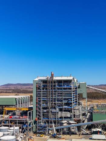Aerial view of Millmerran Power Station featuring its large industrial structure steel framework and surrounding landscape under a clear blue sky in Domville Queensland Australia. Aerial view of Millmerran Power Station featuring its large industrial structure steel framework and surrounding landscape under a clear blue sky in Domville Queensland Australia.