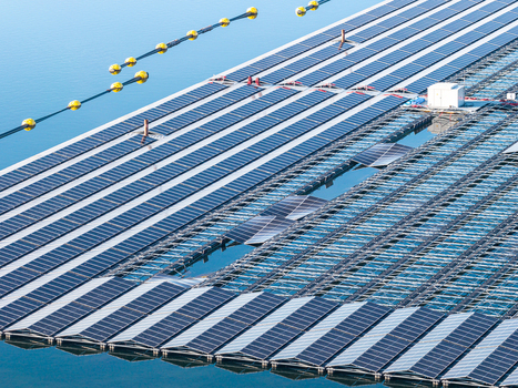 Aerial view of the floating solar farm at Cottbuser Ostsee featuring rows of solar panels on floating platforms with visible repair works following storm damage Cottbus Brandenburg Germany. Aerial view of the floating solar farm at Cottbuser Ostsee featuring rows of solar panels on floating platforms with visible repair works following storm damage Cottbus Brandenburg Germany.