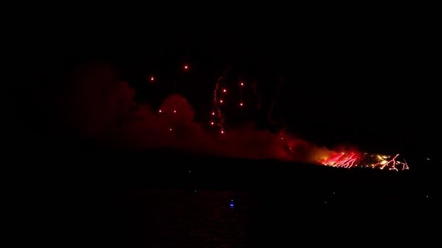 View of Ifestia volcano fireworks display in Fira Greece. View of Ifestia volcano fireworks display in Fira Greece.