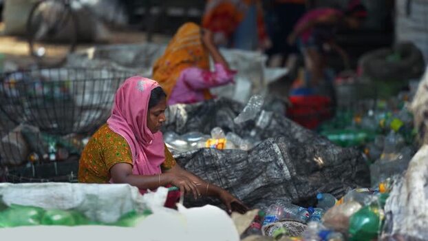 View of women sorting plastic bottles for recycling Bangladesh. View of women sorting plastic bottles for recycling Bangladesh.