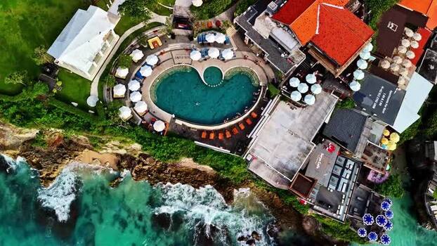 Aerial view of a cliffside resort pool in Bali Indonesia.
