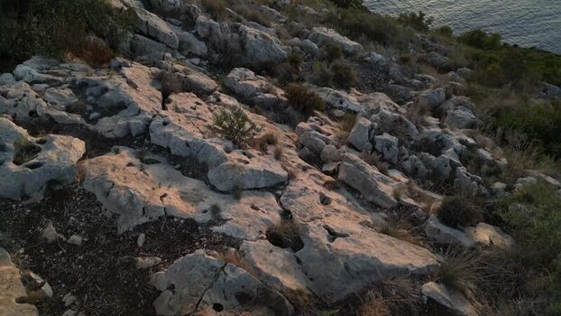 Aerial view of rocky coastal terrain in Moraira Spain.