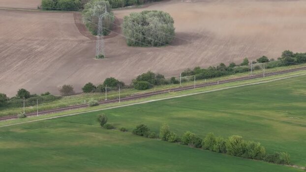 Aerial view of a railway track through agricultural fields Czechia. Aerial view of a railway track through agricultural fields Czechia.