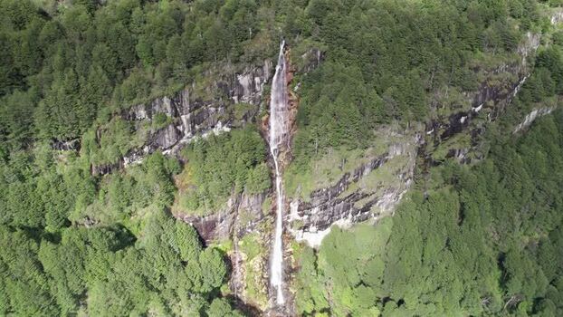 Aerial view of a waterfall in the forest of Chile. Aerial view of a waterfall in the forest of Chile.