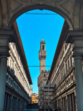 Florence Italy 26 April 2026 View of Palazzo Vecchio framed by the historic arches of the Uffizi Gallery under a clear blue sky. Florence Italy 26 April 2026 View of Palazzo Vecchio framed by the historic arches of the Uffizi Gallery under a clear blue sky.