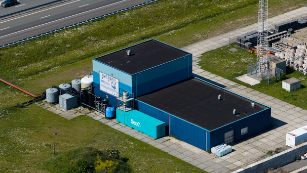 Breezanddijk Netherlands 25 May 2026 Aerial view of the REDstack Blue Energy pilot plant with its blue industrial buildings storage tanks and nearby highway. Breezanddijk Netherlands 25 May 2026 Aerial view of the REDstack Blue Energy pilot plant with its blue industrial buildings storage tanks and nearby highway.