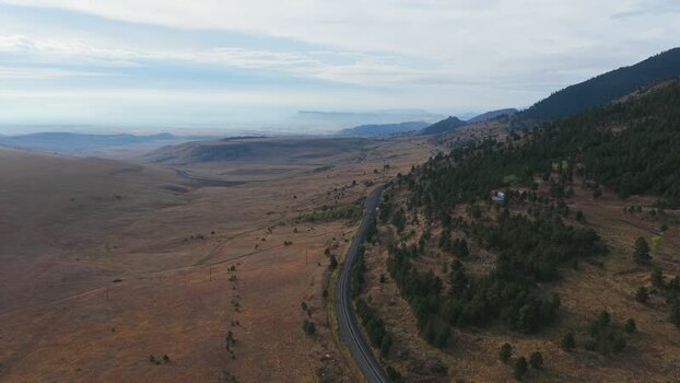 Aerial view of a winding road in the Colorado landscape United States.