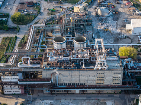 Aerial view of Heizkraftwerk Klingenberg combined heat and power plant featuring industrial pipes cooling towers and concrete structures in Berlin Berlin Germany. Aerial view of Heizkraftwerk Klingenberg combined heat and power plant featuring industrial pipes cooling towers and concrete structures in Berlin Berlin Germany.