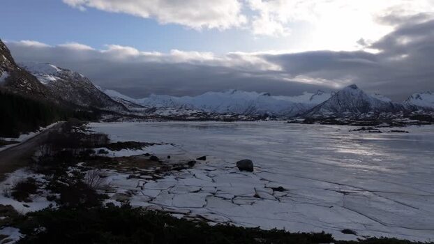 Aerial view of Lofoten mountains and frozen water Norway.