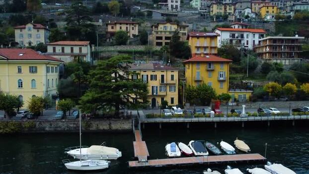 Aerial view of Lake Como waterfront with boats Italy. Aerial view of Lake Como waterfront with boats Italy.