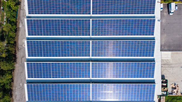 Aerial view of solar panels installed on the roof of a large distribution center in Milan Lombardy Italy. Aerial view of solar panels installed on the roof of a large distribution center in Milan Lombardy Italy.