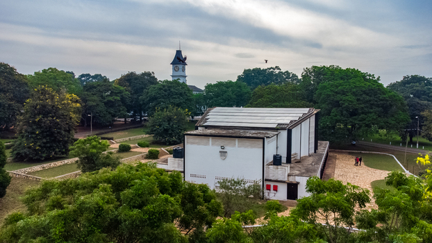 Aerial view of Achimota School campus featuring a clock tower and a building with solar panels surrounded by lush trees and greenery in Achimota Greater Accra Region Ghana. Aerial view of Achimota School campus featuring a clock tower and a building with solar panels surrounded by lush trees and greenery in Achimota Greater Accra Region Ghana.