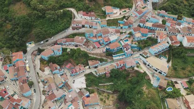 Aerial view of the blue houses of Juzcar Spain.