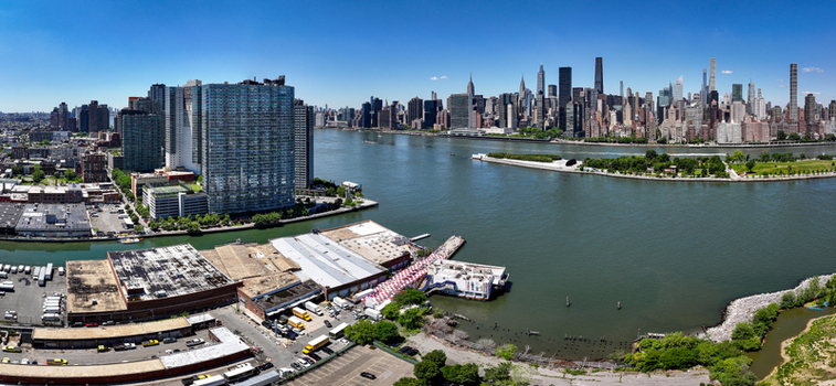 Long Island City United States 13 June 2026 Aerial view of the Manhattan skyline across the East River with a Croatia FIFA World Cup fan zone event and red and white patterns.