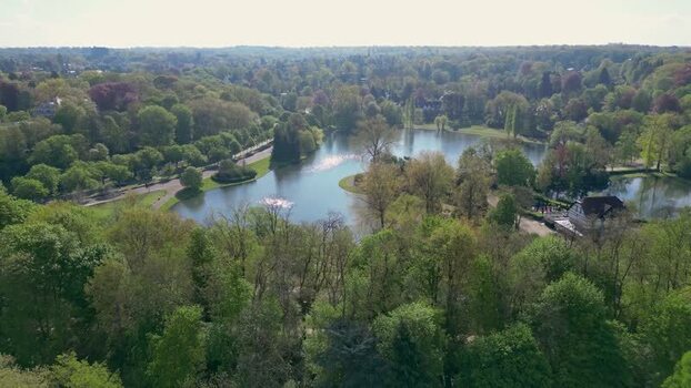 Aerial view of Woluwe Park with its serene lake and lush forest Belgium. Aerial view of Woluwe Park with its serene lake and lush forest Belgium.