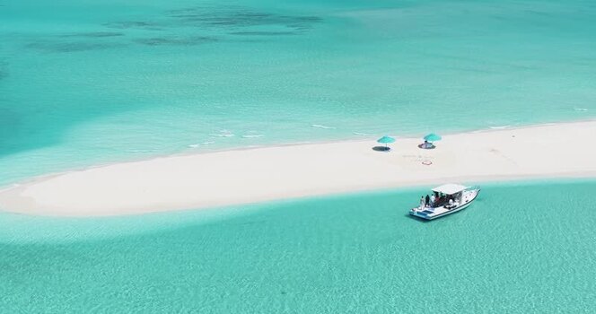 Aerial view of a boat by a white sandbank Maldives. Aerial view of a boat by a white sandbank Maldives.