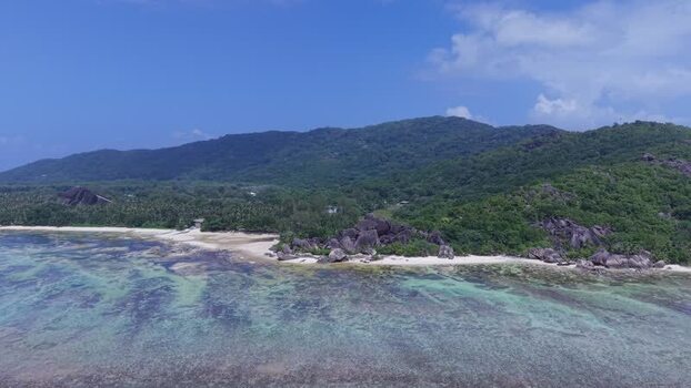 Aerial view of Anse Reunion beach and granite rocks Seychelles.