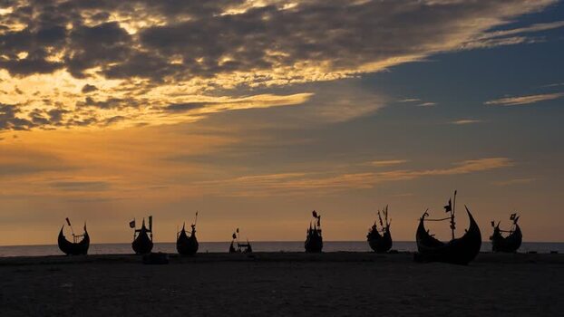 View of silhouetted fishing boats at sunset Bangladesh. View of silhouetted fishing boats at sunset Bangladesh.