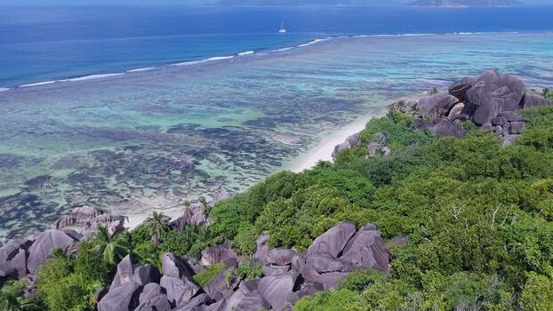 Aerial view of Anse Reunion beach with granite boulders Seychelles.