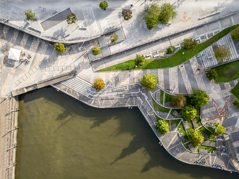 Aerial view of the Marco Polo Terassen in the Hafencity with stone paved walkways and steps leading to the water in Hamburg Germany.