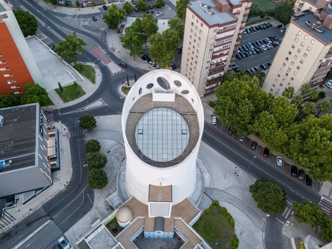 Alges Portugal 25 July 2026 Aerial view of the Santissima Trindade Church featuring its distinctive cylindrical white architecture glass roof and surrounding urban streets.