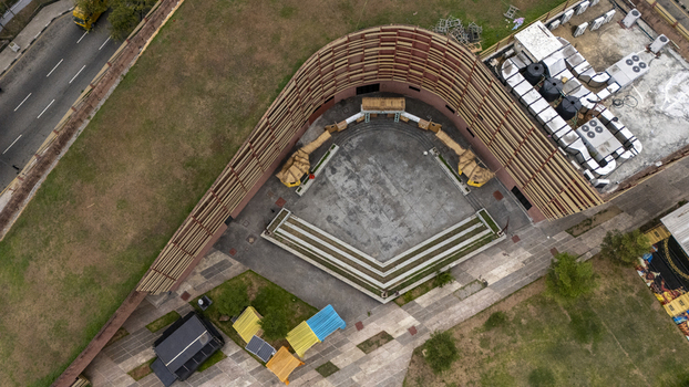 Aerial view of the outdoor amphitheater on Lagos Island featuring curved wooden walls concrete seating and surrounding grounds in Lagos Lagos Nigeria. Aerial view of the outdoor amphitheater on Lagos Island featuring curved wooden walls concrete seating and surrounding grounds in Lagos Lagos Nigeria.