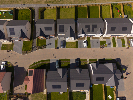 Linlithgow United Kingdom 29 April 2026 Aerial view of a modern residential housing estate featuring houses with solar panels neat gardens and cars parked on driveways. Linlithgow United Kingdom 29 April 2026 Aerial view of a modern residential housing estate featuring houses with solar panels neat gardens and cars parked on driveways.