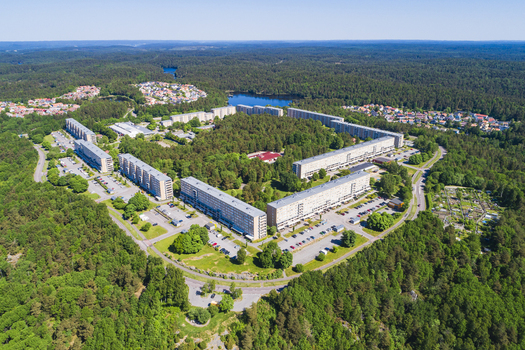 Aerial view of Rannebergen residential area featuring large apartment blocks surrounded by dense forests and green spaces in Gothenburg Vastra Gotaland County Sweden.