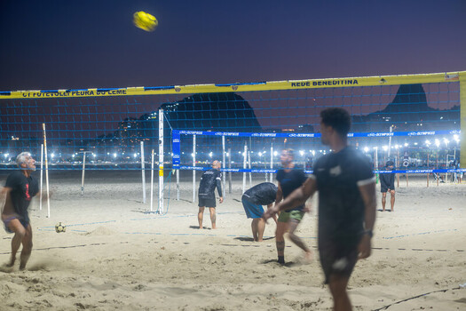 Rio de Janeiro Brazil 08 June 2026 View of people playing footvolley on Copacabana beach at night with floodlights and city lights in the background.
