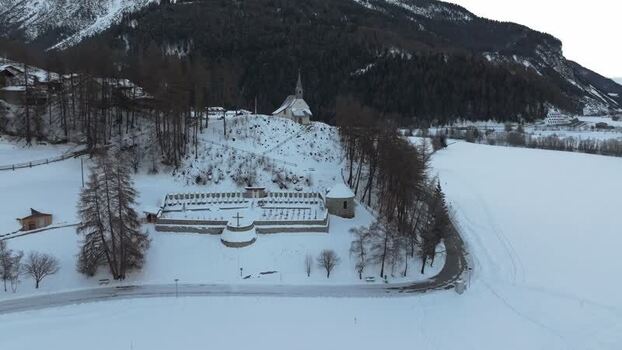 Aerial view of church on a hill in Graun im Vinschgau Italy. Aerial view of church on a hill in Graun im Vinschgau Italy.
