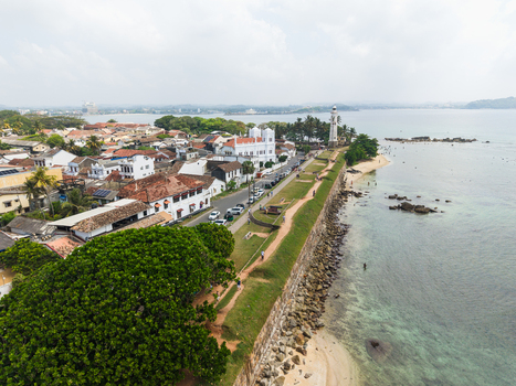 Aerial view of Galle Lighthouse and the historic ramparts of Galle Fort overlooking the Indian Ocean in Galle Southern Province Sri Lanka. Aerial view of Galle Lighthouse and the historic ramparts of Galle Fort overlooking the Indian Ocean in Galle Southern Province Sri Lanka.