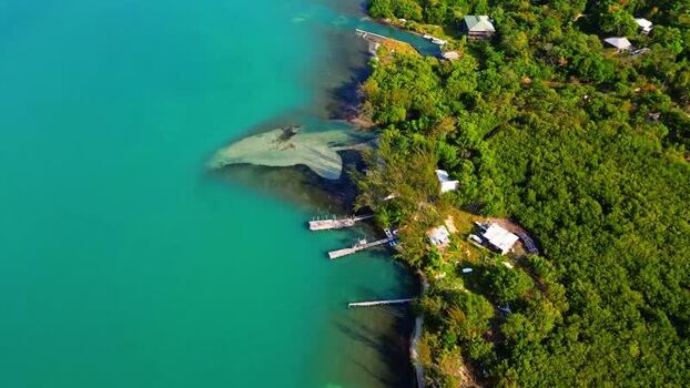 Aerial view of the lush coastline and turquoise waters of Honduras.