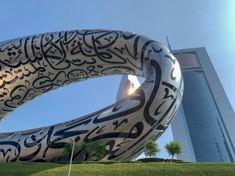 View of The Museum of the Future with its iconic Arabic calligraphy facade and modern architectural design set against a clear blue sky in Dubai Dubai United Arab Emirates. View of The Museum of the Future with its iconic Arabic calligraphy facade and modern architectural design set against a clear blue sky in Dubai Dubai United Arab Emirates.