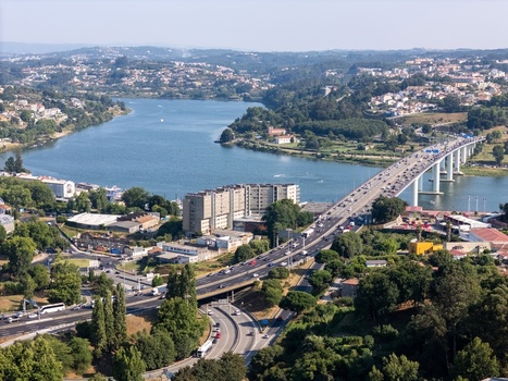 Aerial view of Ponte Infante Dom Henrique spanning the Douro River with heavy traffic and surrounding urban landscape in Vila Nova de Gaia Porto Portugal.