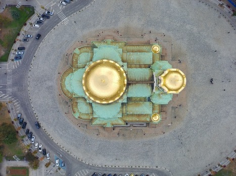 Aerial view of the Alexander Nevsky Cathedral with its iconic golden domes and green copper roof surrounded by the historic cobblestone square in Sofia Sofia City Province Bulgaria.